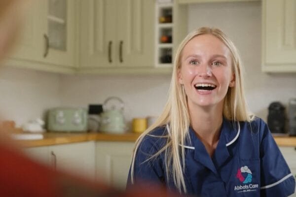 A Care worker smiles