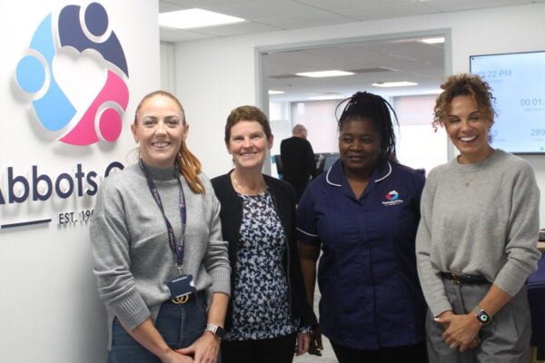 Michelle Dyson stands with Senior managers of Abbots Care