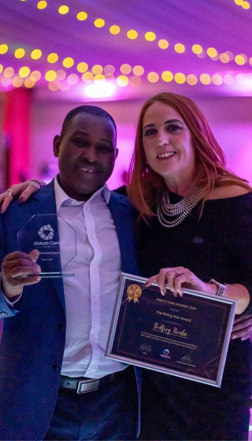 Godfrey posing with operations director Helen Sinden after winning the rising star award