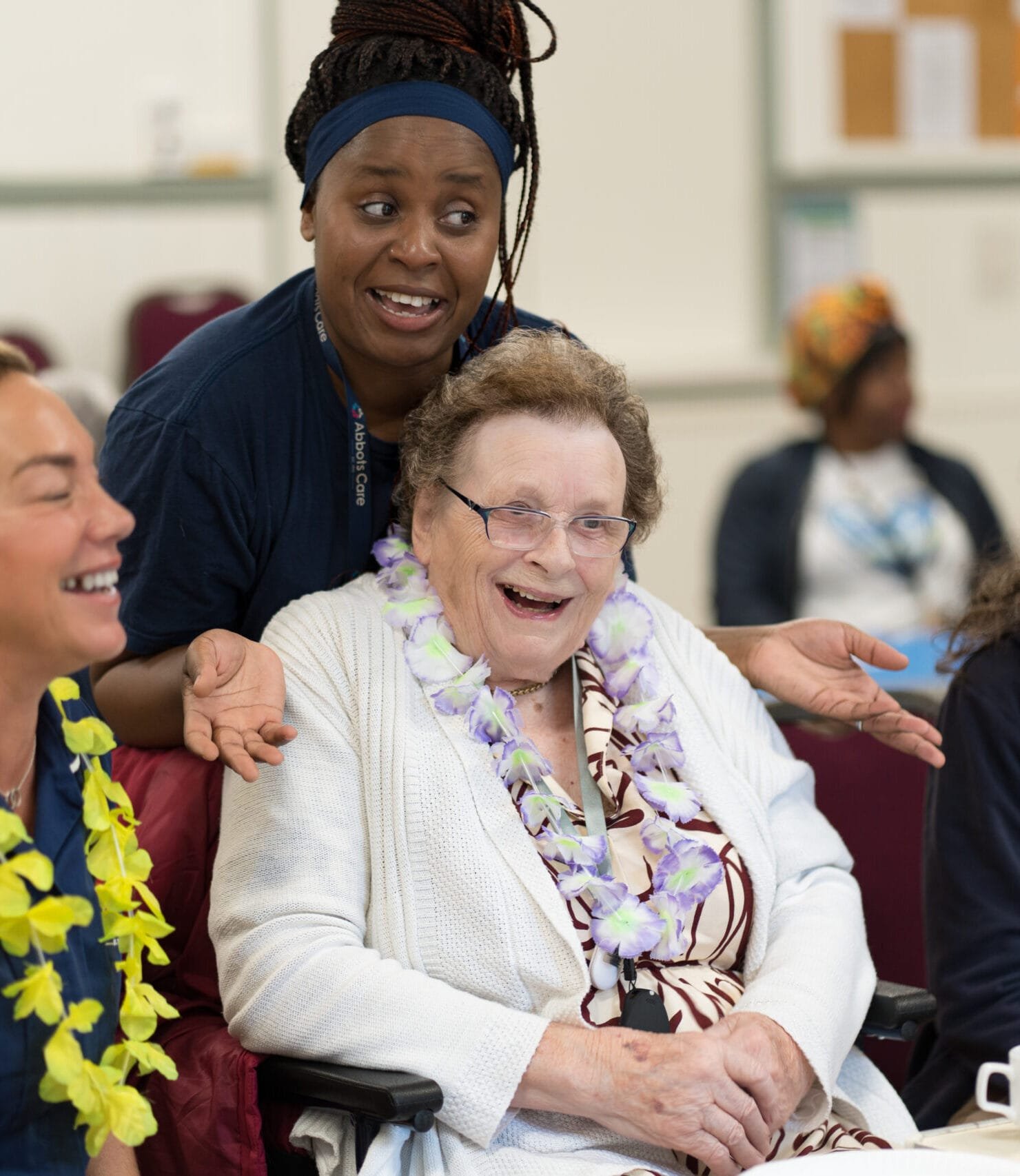 Care Workers and Client laugh at an Abbots Friends tea party