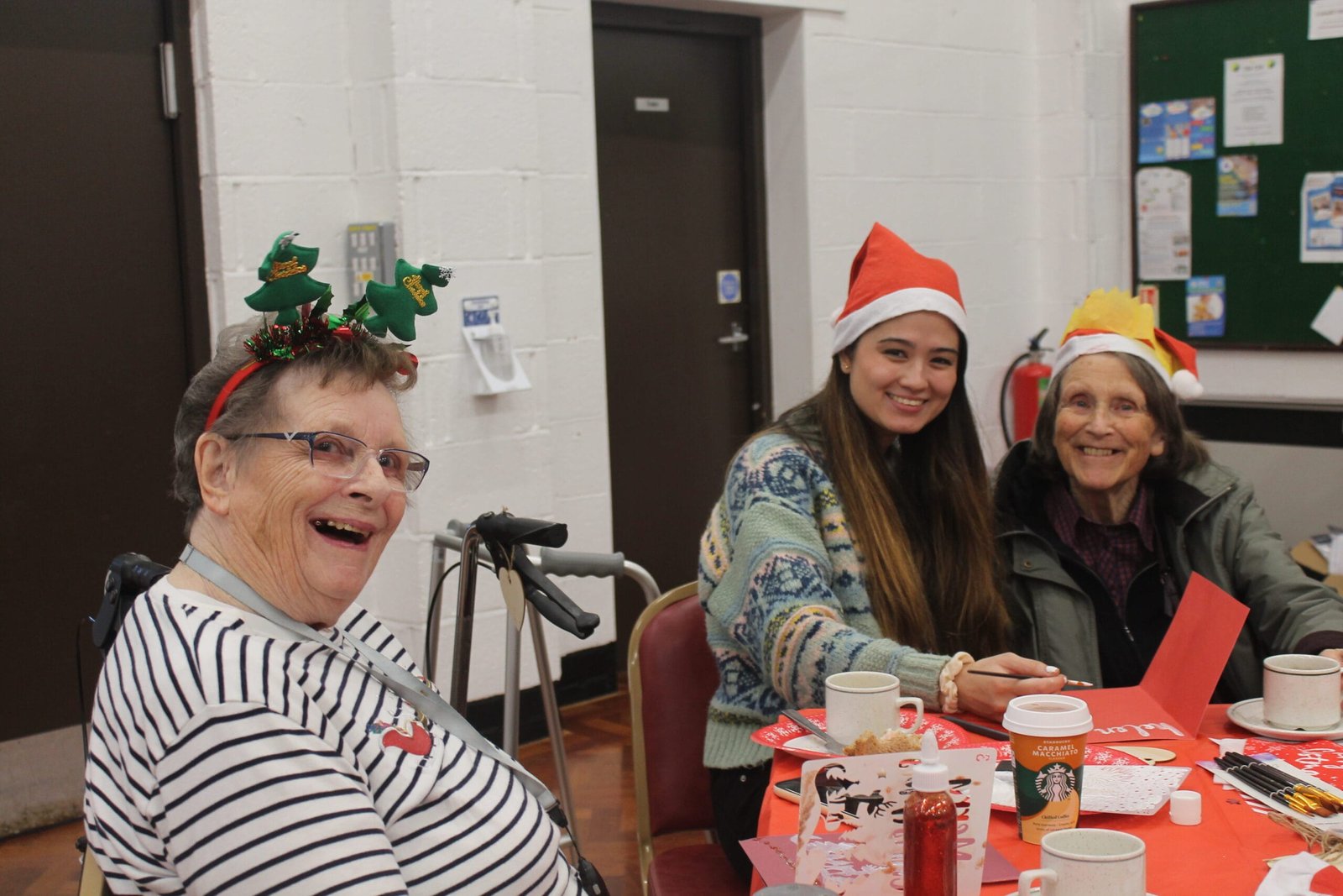 Clients and volunteers at a christmas tea party