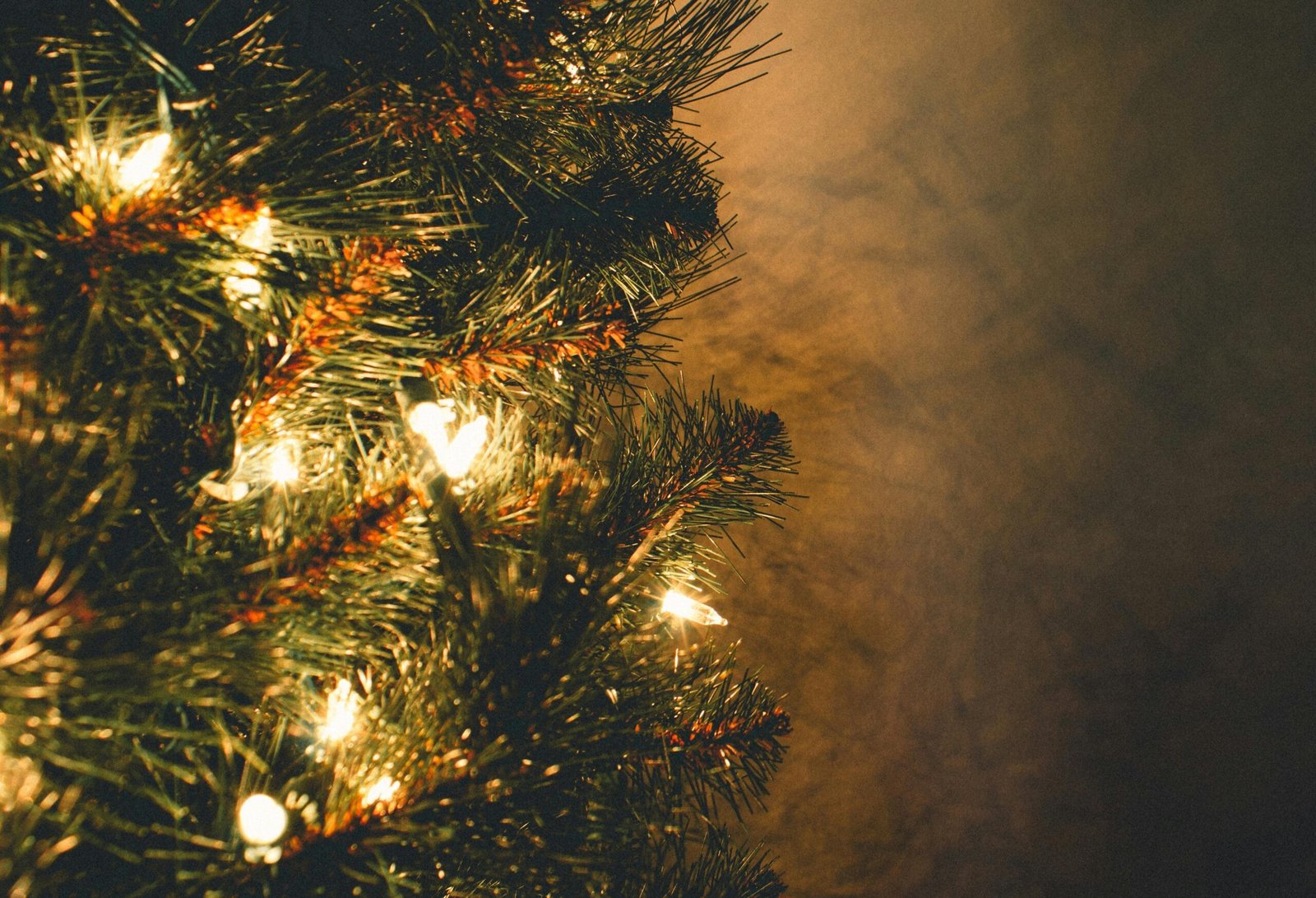 Close up shot of a lit up Christmas tree