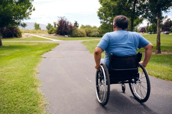 Man in wheelchair out