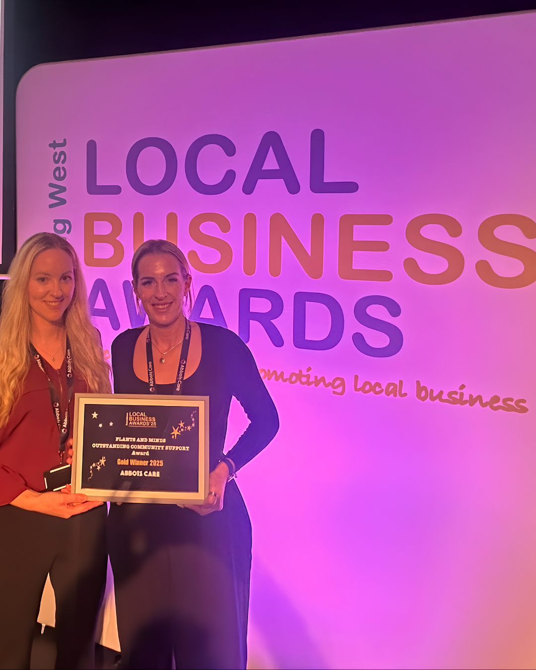 Abbots Care community facilitator accepting an award at the local business awards