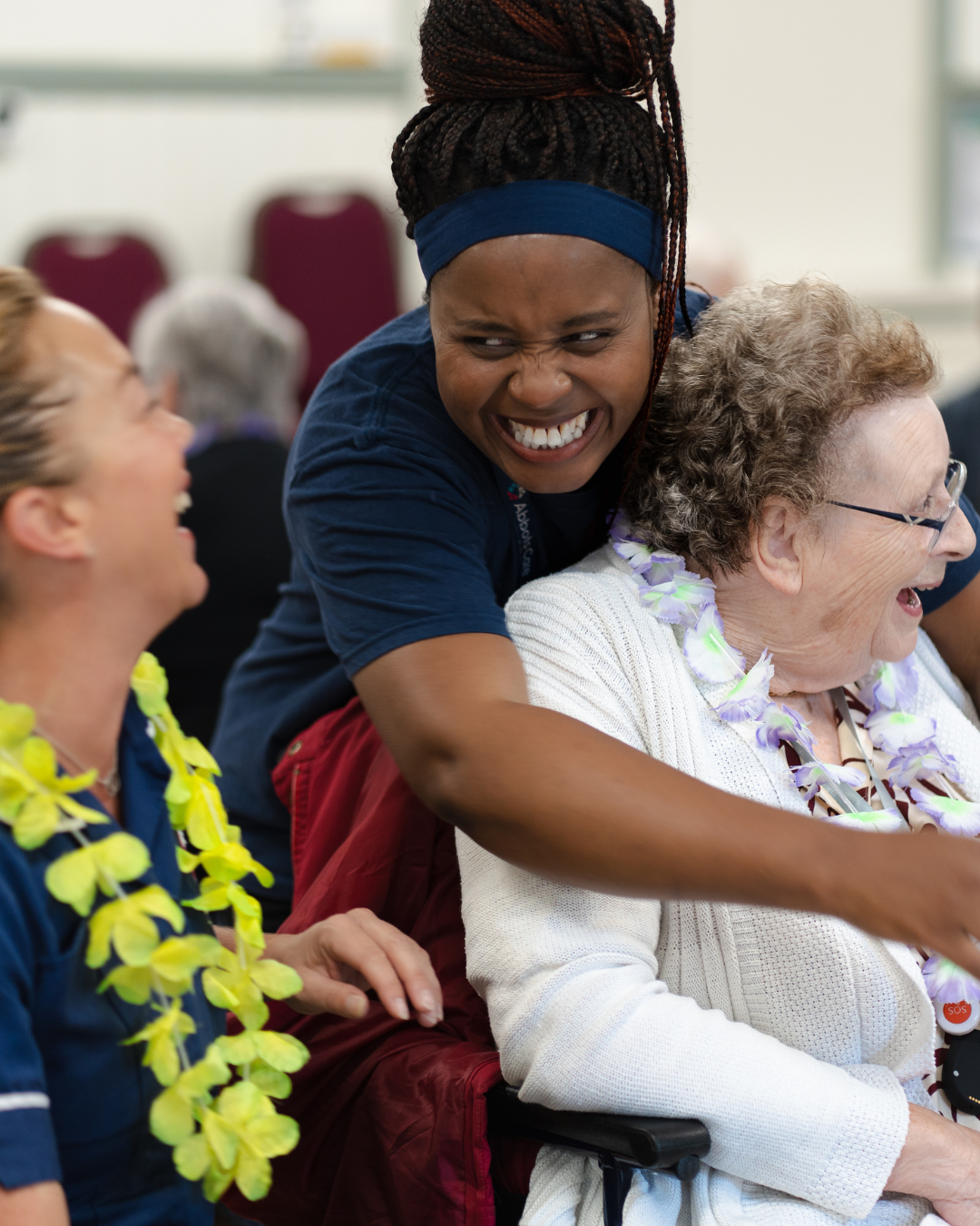 two carers and a client at the Dorset tea party laughing